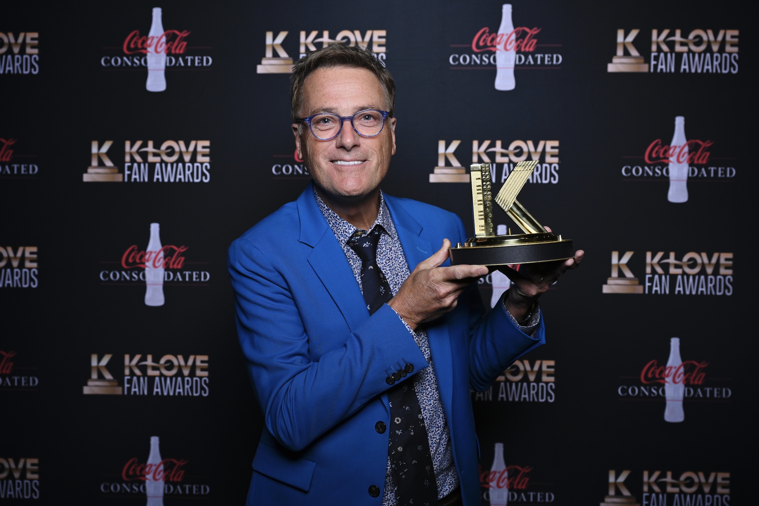 Michael W Smith holding Book Impact award at the 2022 K-LOVE Fan Awards