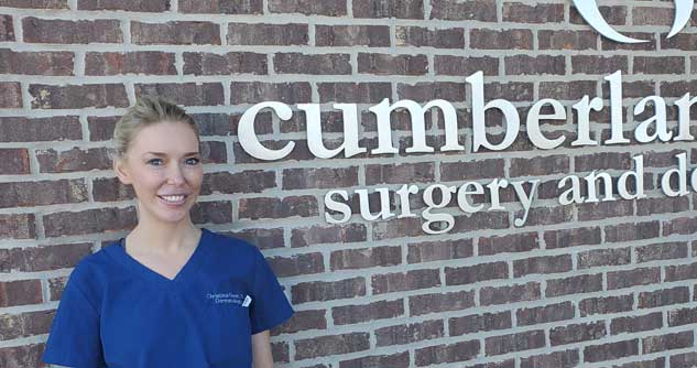 Dr. Christina Feser stands outside her workplace