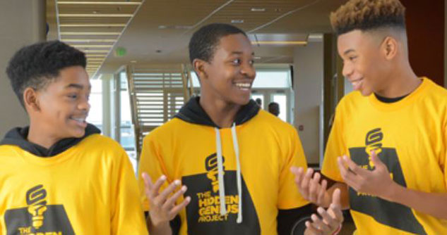 3 black teens smiling, wearing yellow hidden genius project hoodies