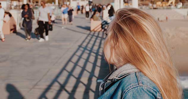 Girl on boardwalk, can