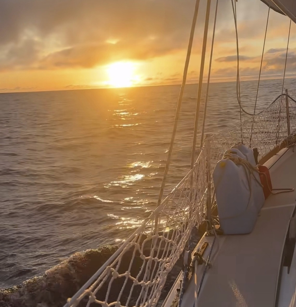 Widger shows the sunset somewhere in the Pacific Ocean as he and his cat, Phoenix, sail from Oregon to Hawaii