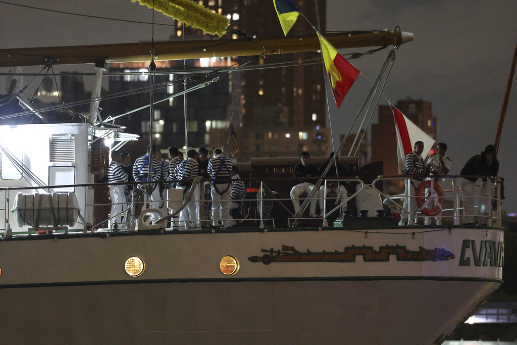 Crew members aboard the Cuauhtémoc, a masted Mexican Navy training ship, gather on deck after the ship collided with the Brooklyn Bridge