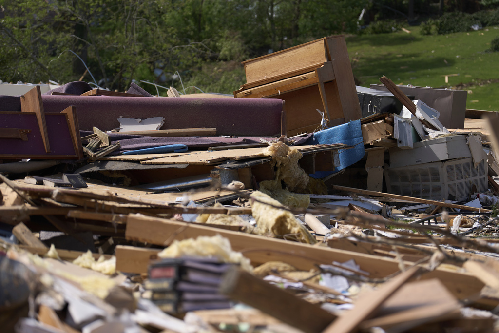A piano rests atop what is left of the destroyed Sunshine Hill Baptist Church in London, Ky.