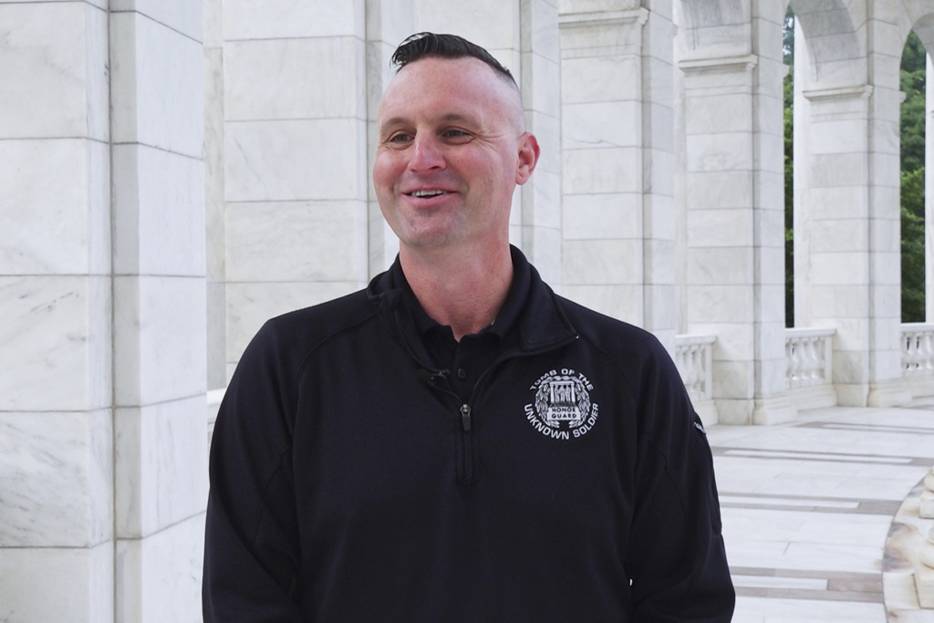 Army Sgt. 1st Class Andrew Jay speaks during an interview with The Associated Press at Arlington National Cemetery in Arlington, Va.