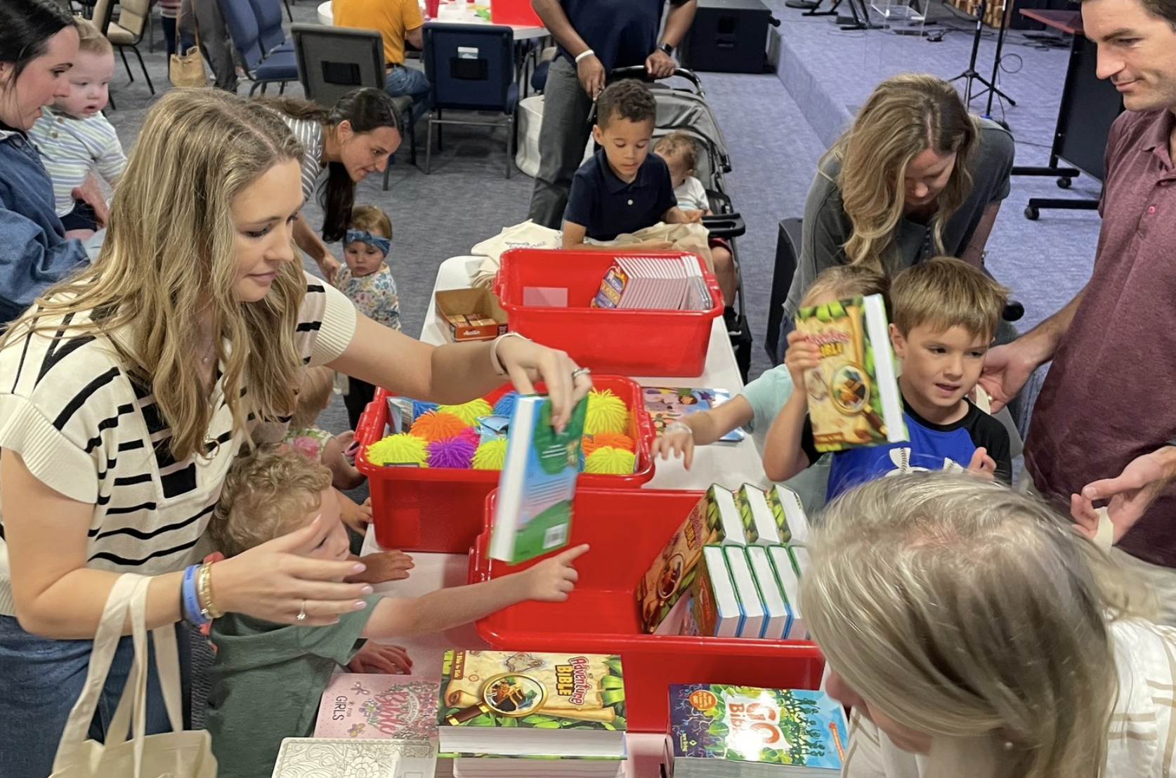 Moms with children getting free Bibles