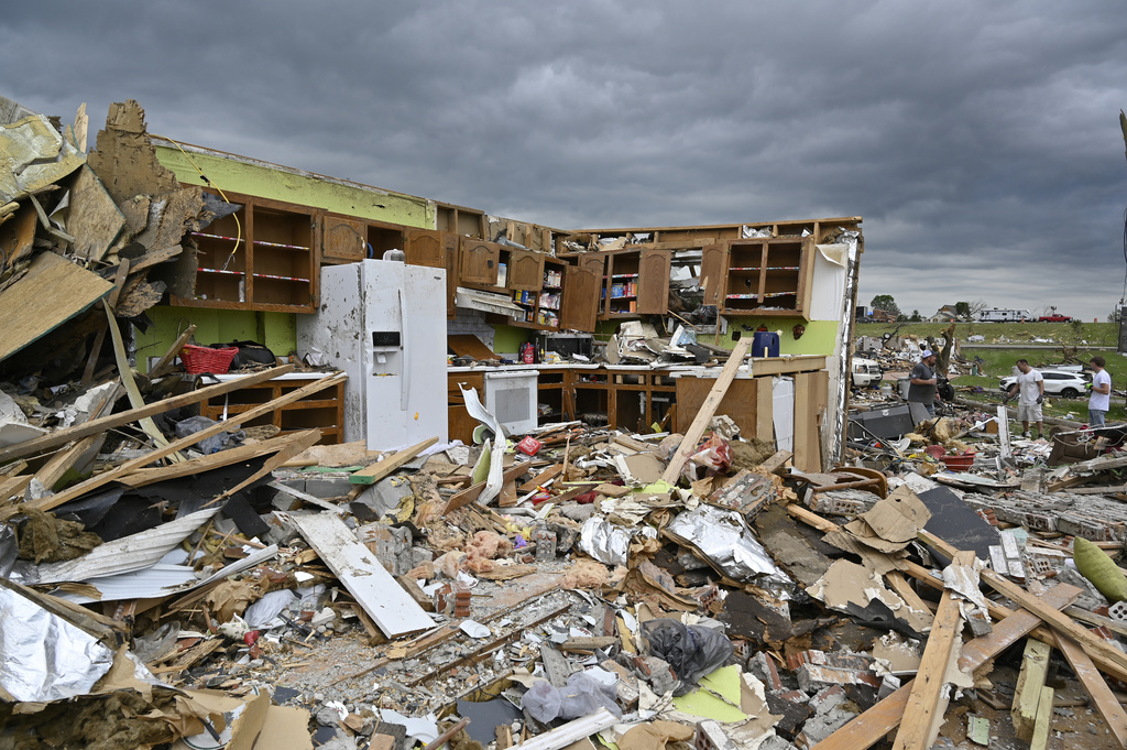 Remains of a kitchen surrounded by debris after severe storms in the Sunshine Hills neighborhood in London, Ky.