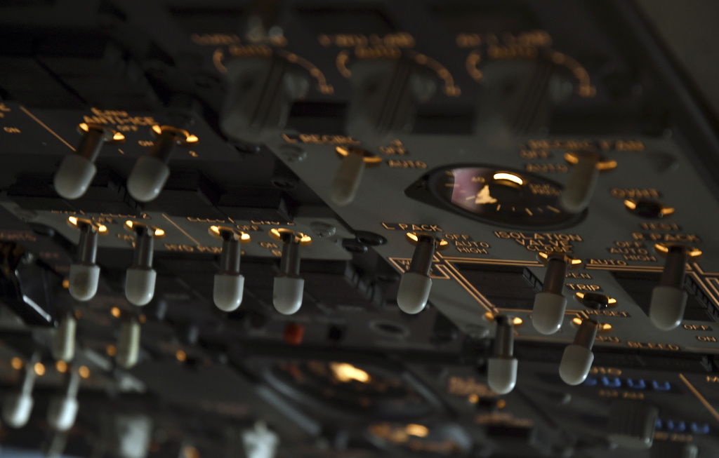 Switches in the cockpit of a United Airlines flight simulator are lit up at the company