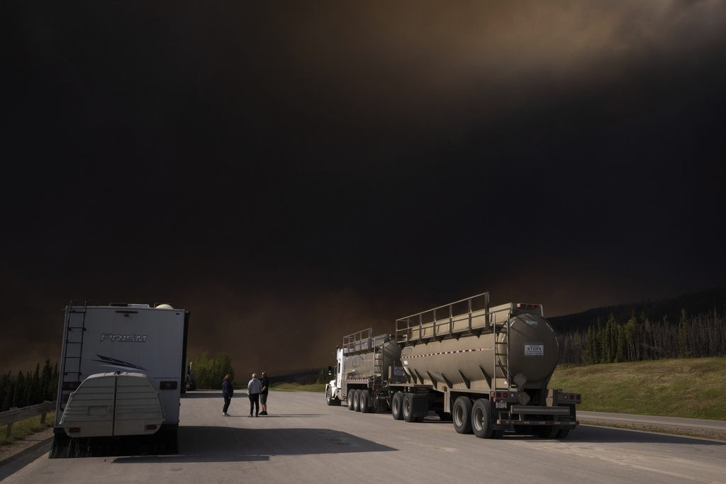 Wildfire smoke hangs in the air above Highway 97 north of Buckinghorse River, British Columbia