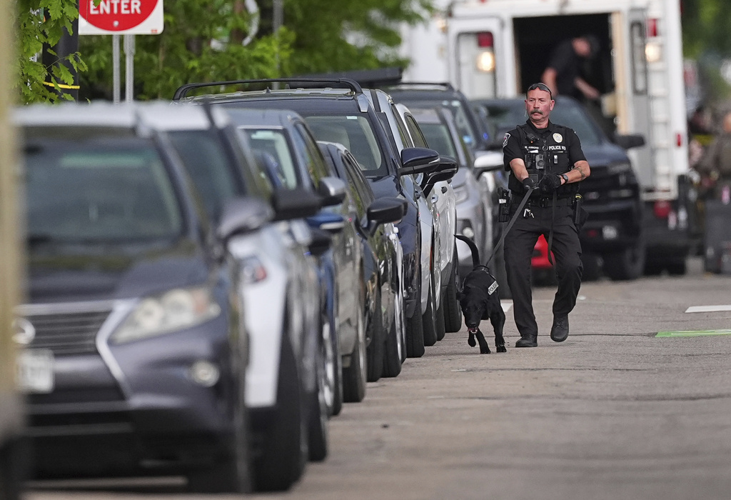 Law enforcement officials investigate after an attack on the Pearl Street Mall