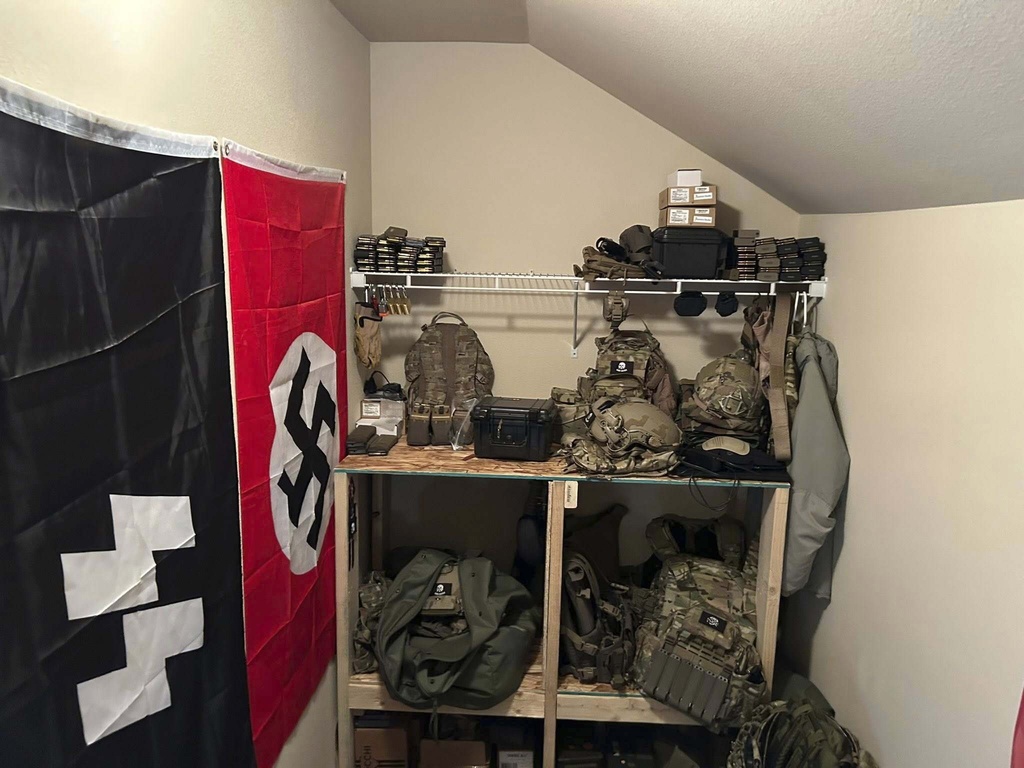 A cache of military weaponry and Nazi paraphernalia are photographed during a raid at a home in Lacey, Wash.