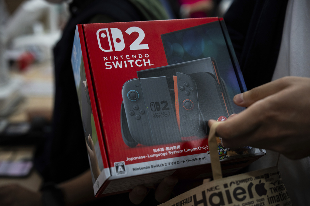 customer purchases Nintendo Switch 2 at an electronics retailer