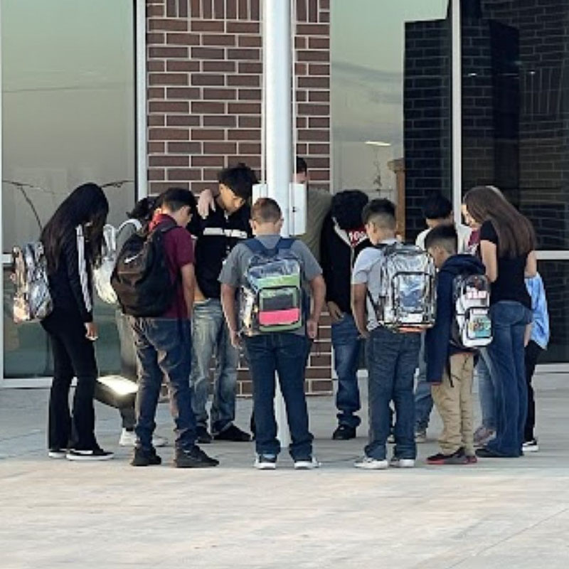 Santa Fe Middle School C3 students praying around the flag pole