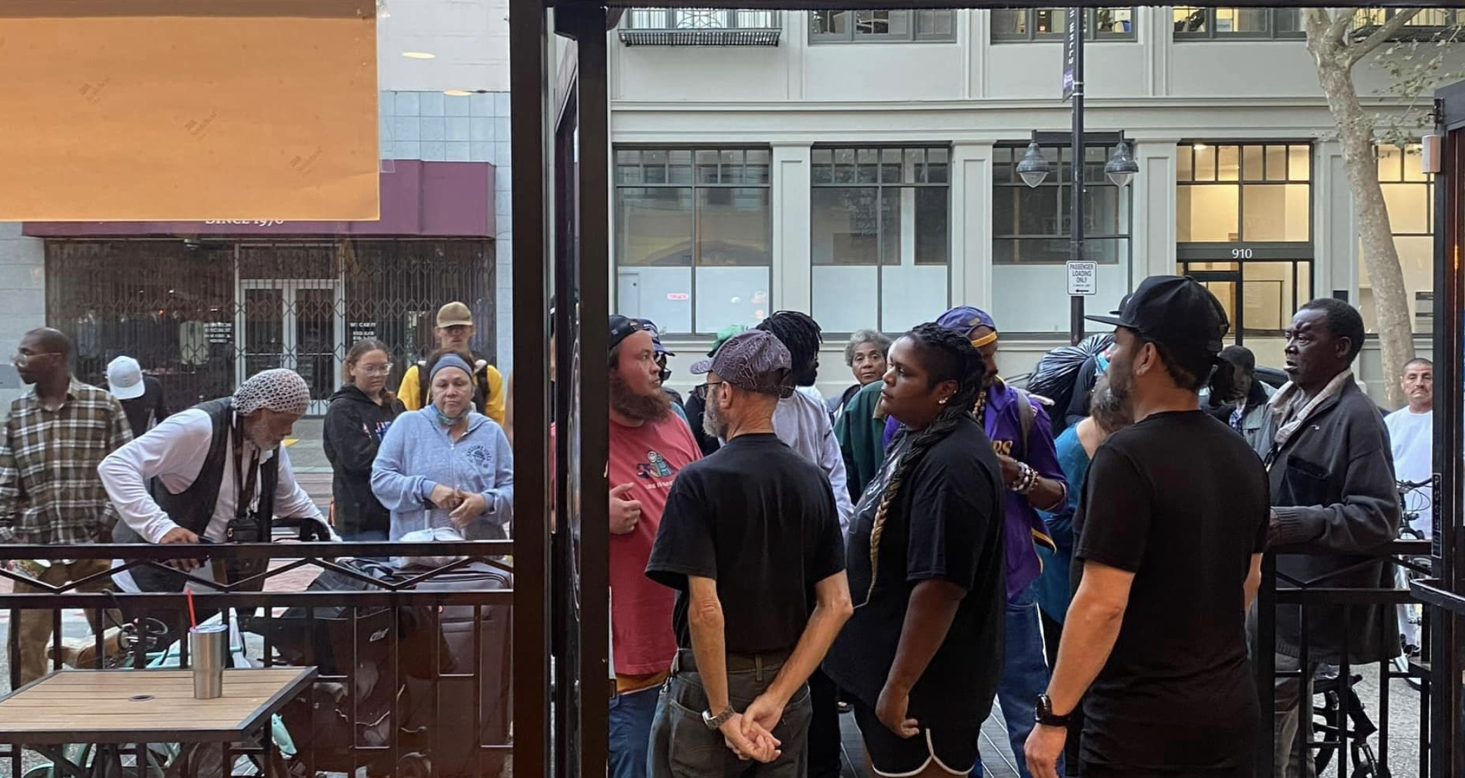 Woman and crowd in front of restaurant