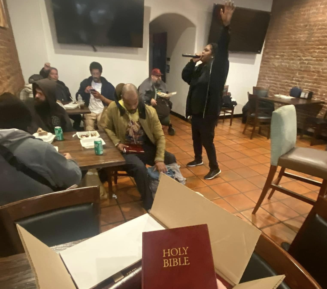 Woman preaching to group
