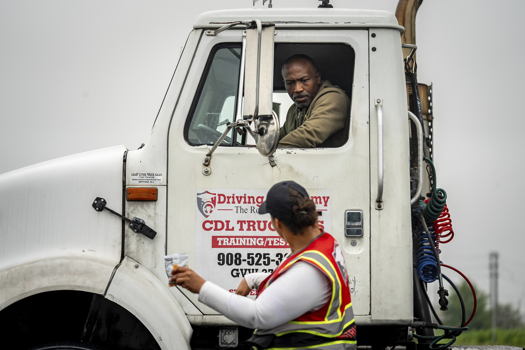 An instructor provides reverse parking advice to a student at the Driving Academy on Tuesday, June 10, 2025 in Linden, N.J., where students prepare to obtain a Commercial Driver’s License (CDL) with multilingual instructors