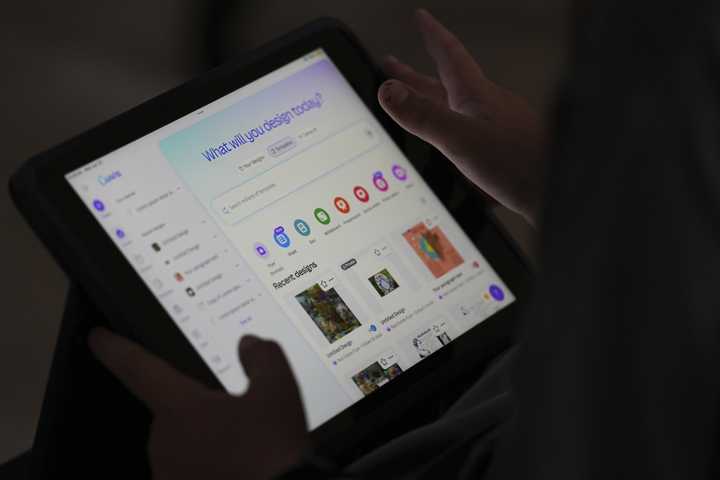 A student is taught how to ask Canva for help during a summer class at Roosevelt Middle School in River Forest, Ill.