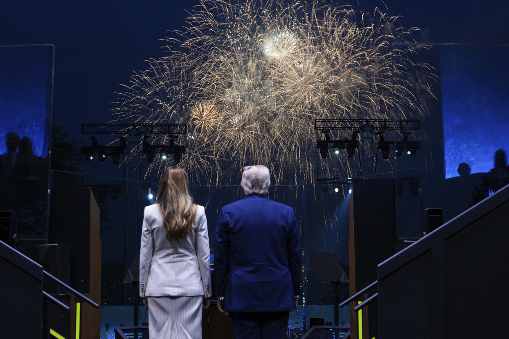 President Donald Trump and first lady Melania Trump watch fireworks following a parade to honor the Army