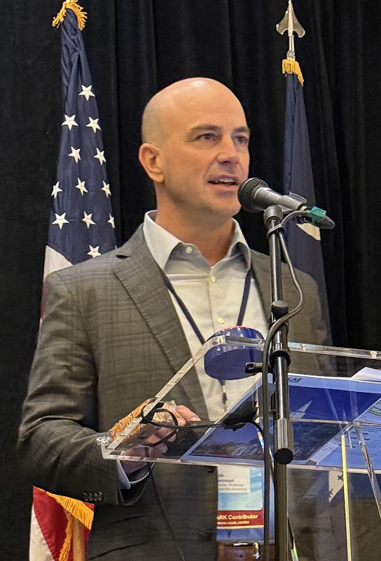 Dr. Seth Hamman speaks at a cyber security conference