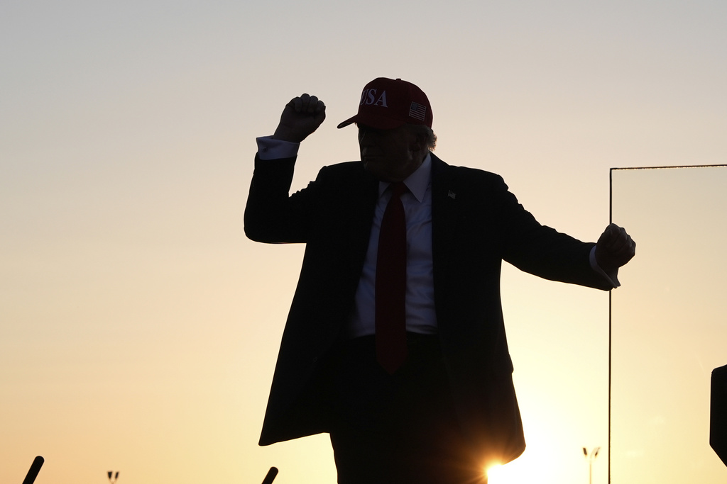 President Donald Trump dances after speaking at a rally at the Iowa State Fairgrounds