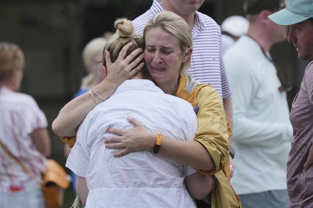 Families are reunited at a reunification center after flash flooding