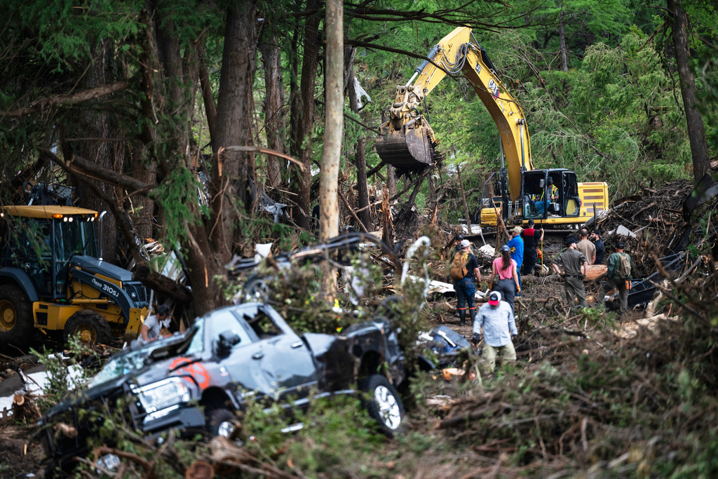 First responders carry out search and rescue operations near the Guadalupe River