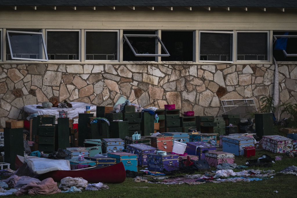 Campers belongings sit outside one of Camp Mystic