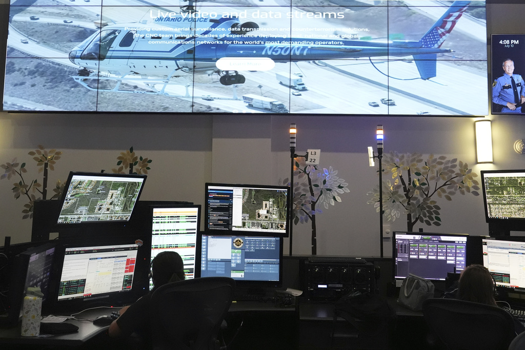 Dispatchers work emergency calls at the Collier County Emergency Services Center