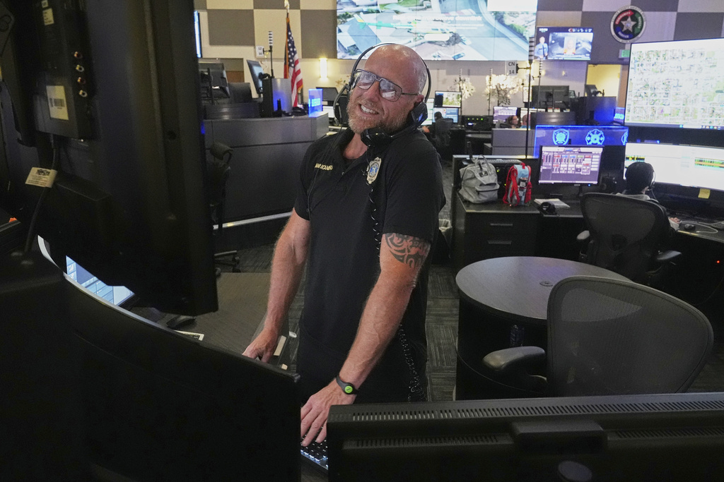 Senior dispatcher Jude Sannicandreo responds to an emergency call at the Collier County Emergency Services Center