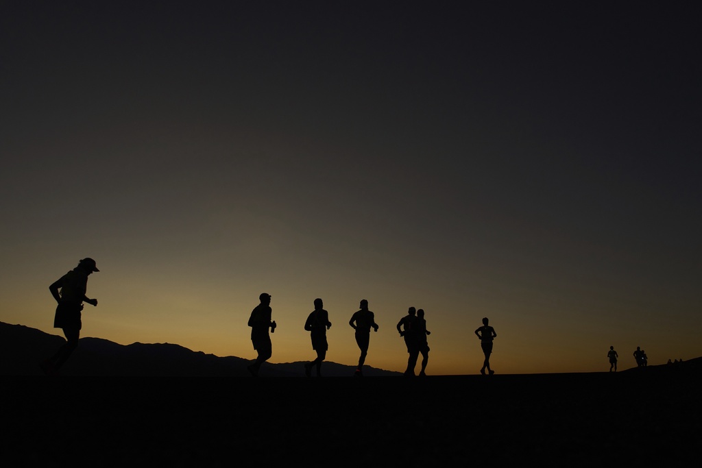Danny Westergaard, leading the center group of runners, competes during the Badwater 135 Ultramarathon