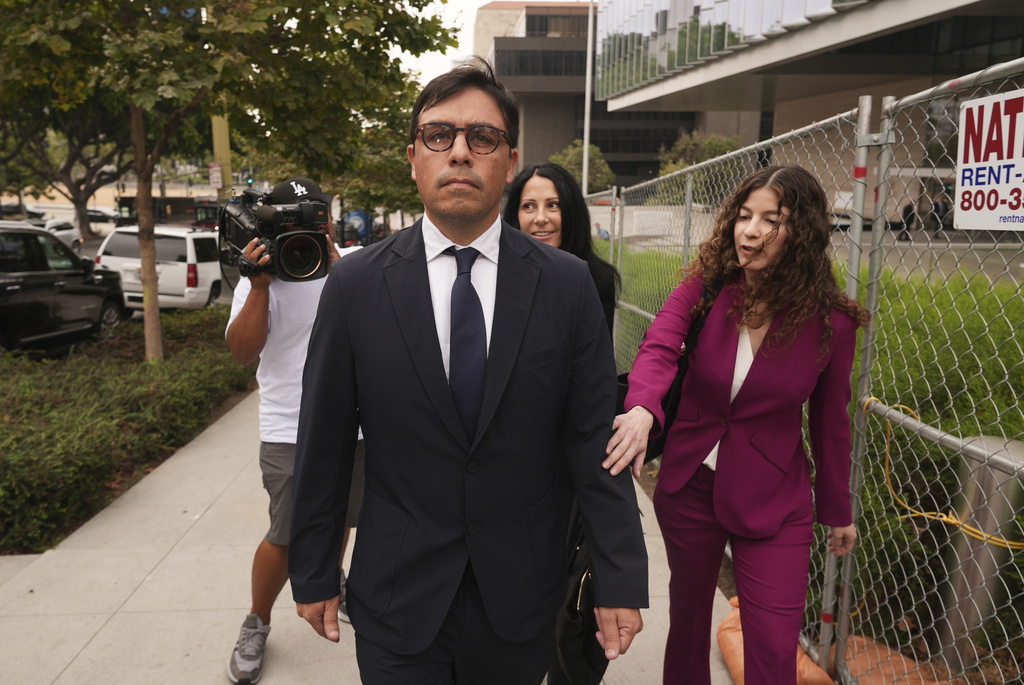 Dr. Salvador Plasencia leaves federal court with his attorneys in Los Angeles, after pleading guilty to giving ketamine to Matthew Perry
