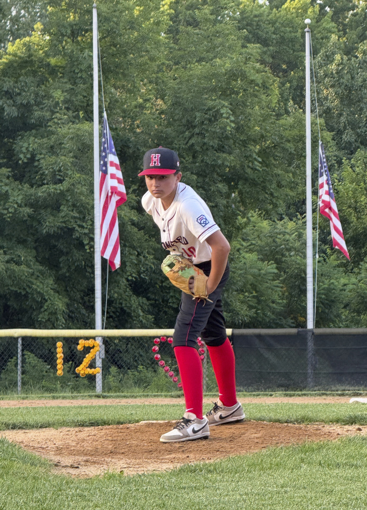 Marco Rocco prepares to deliver a pitch in a baseball game in Haddonfield, N.J.