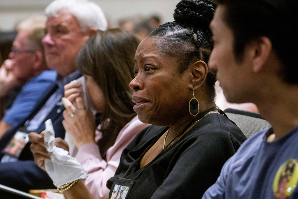 Gwen Duggins, second from right, whose daughter Kiah Duggins perished on American Airlines flight 5342 in a collision