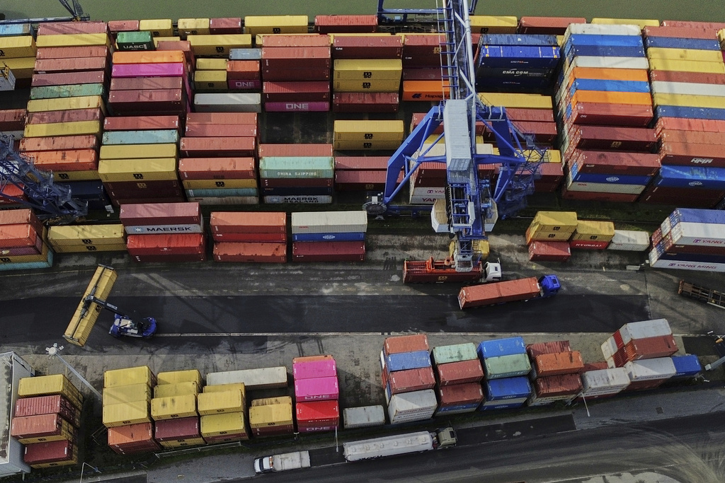 Containers are piled up in a cargo terminal