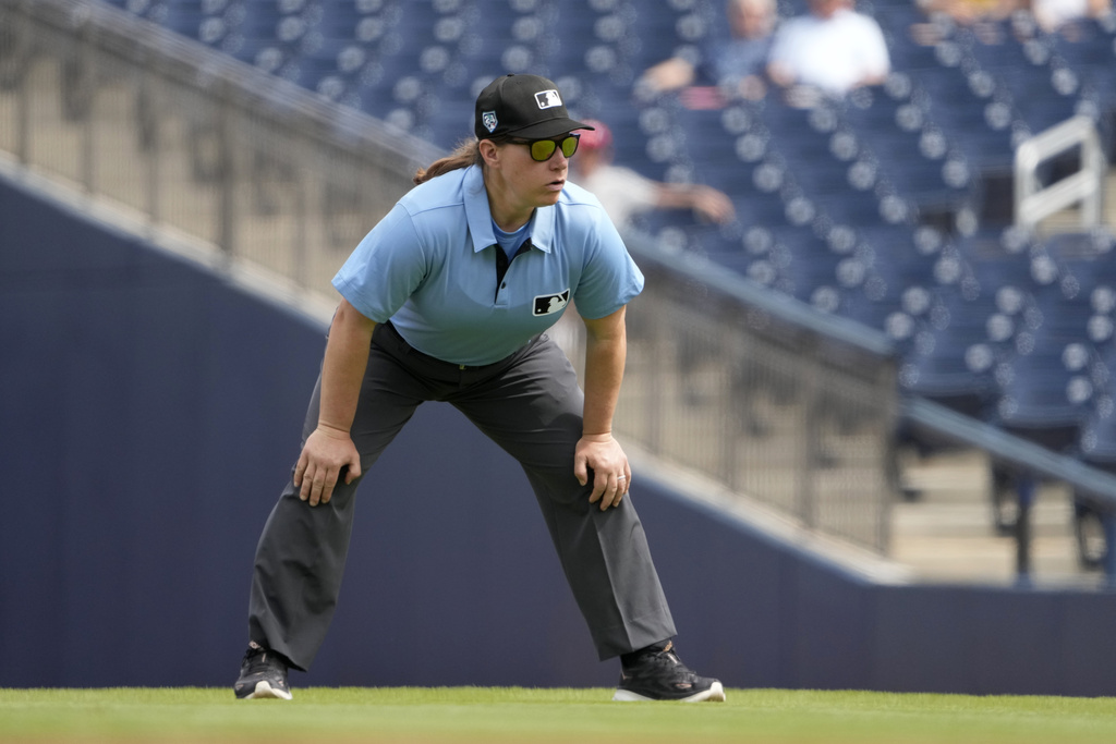 Umpire Jen Pawol takes her position during the first inning of a spring training baseball game between the St. Louis Cardinals and Washington Nationals Monday, March 4, 2024