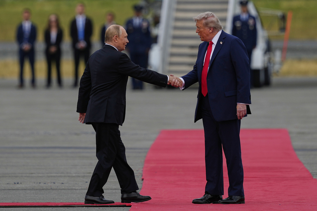 President Donald Trump greets Russia