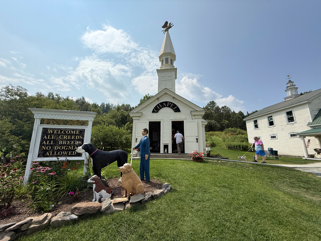 Visitors enter the Dog Chapel at Dog Mountain, a 150-acre dog park created by Vermont folk artist Stephen Huneck