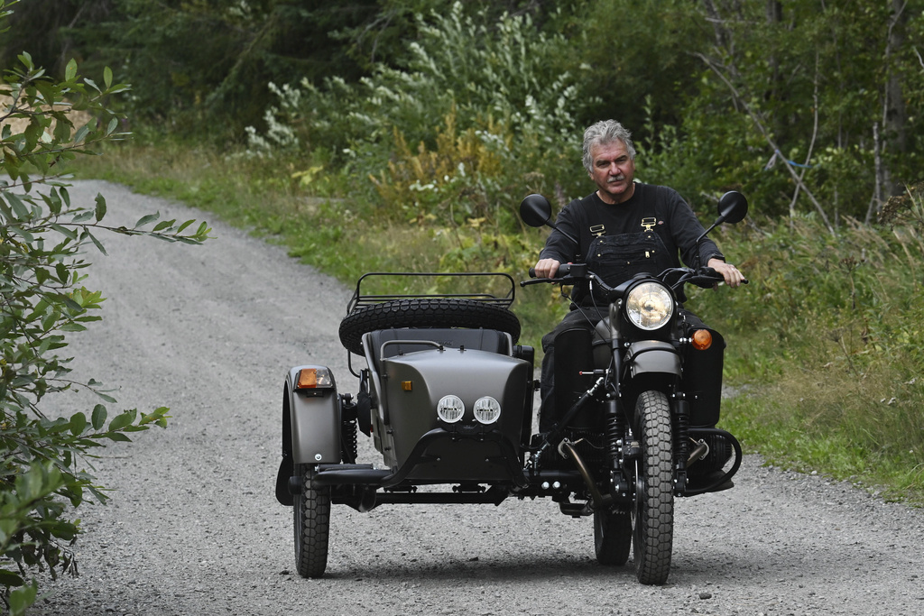 Alaska resident Mark Warren rides the a new Ural motorcycle he received as a gift from the Russian government