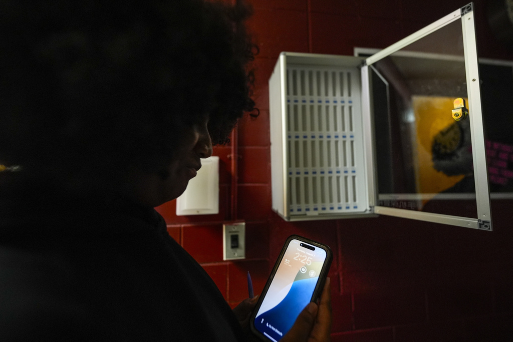 Student Audreanna Johnson near a cell phone locker at Ronald McNair Sr. High School in Atlanta