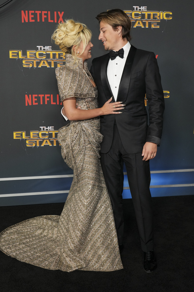 Millie Bobby Brown and Jake Bongiovi arrive at the premiere of "The Electric State"