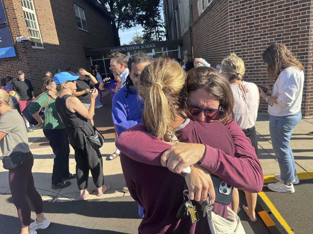 Parents await news of their children after shooting at Annunciation Church
