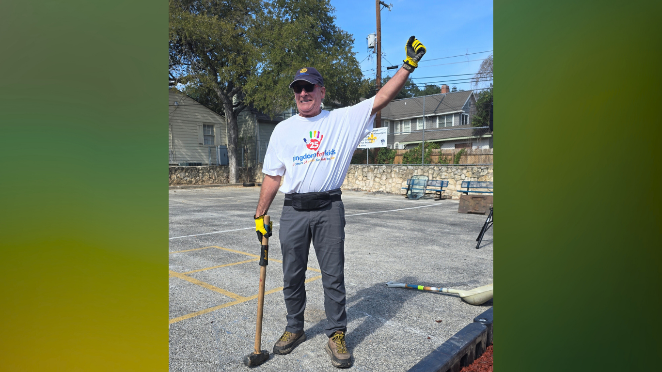Rick Cavender raises his hand in excitement as another kingdom for kids has been completed