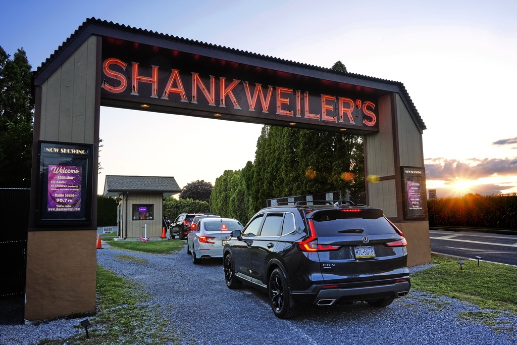 The sun sets on the Shankweiler Drive-In as cars arrive for the evening