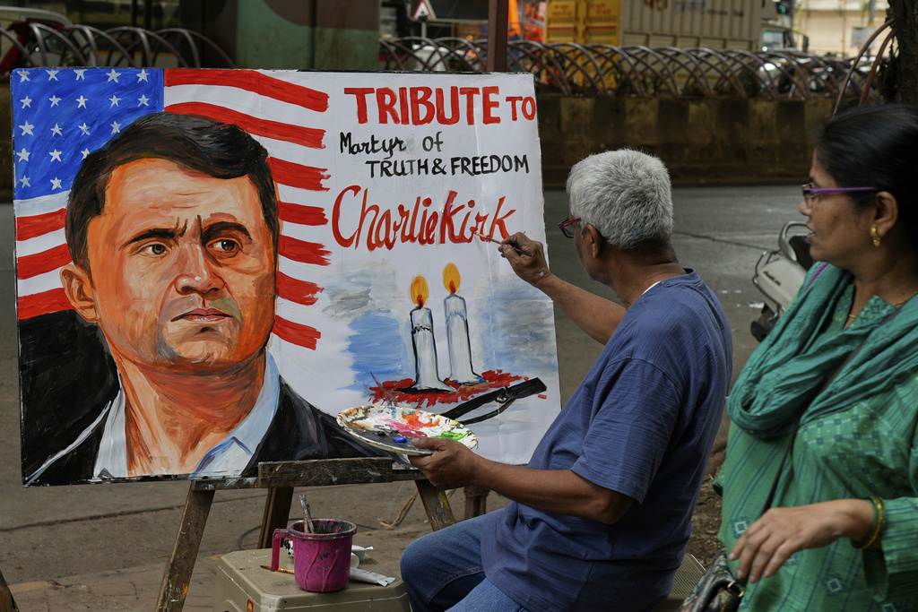 A teacher from Gurukul school of Art completes artwork to pay tribute to Charlie Kirk 
