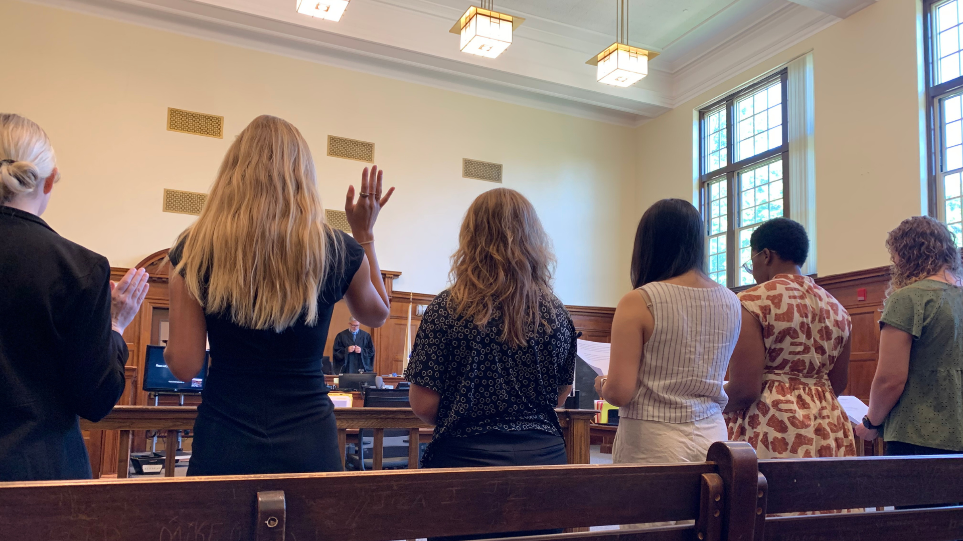 A group of new Boston CASA volunteers are legally sworn in during a ceremony in June 2025.