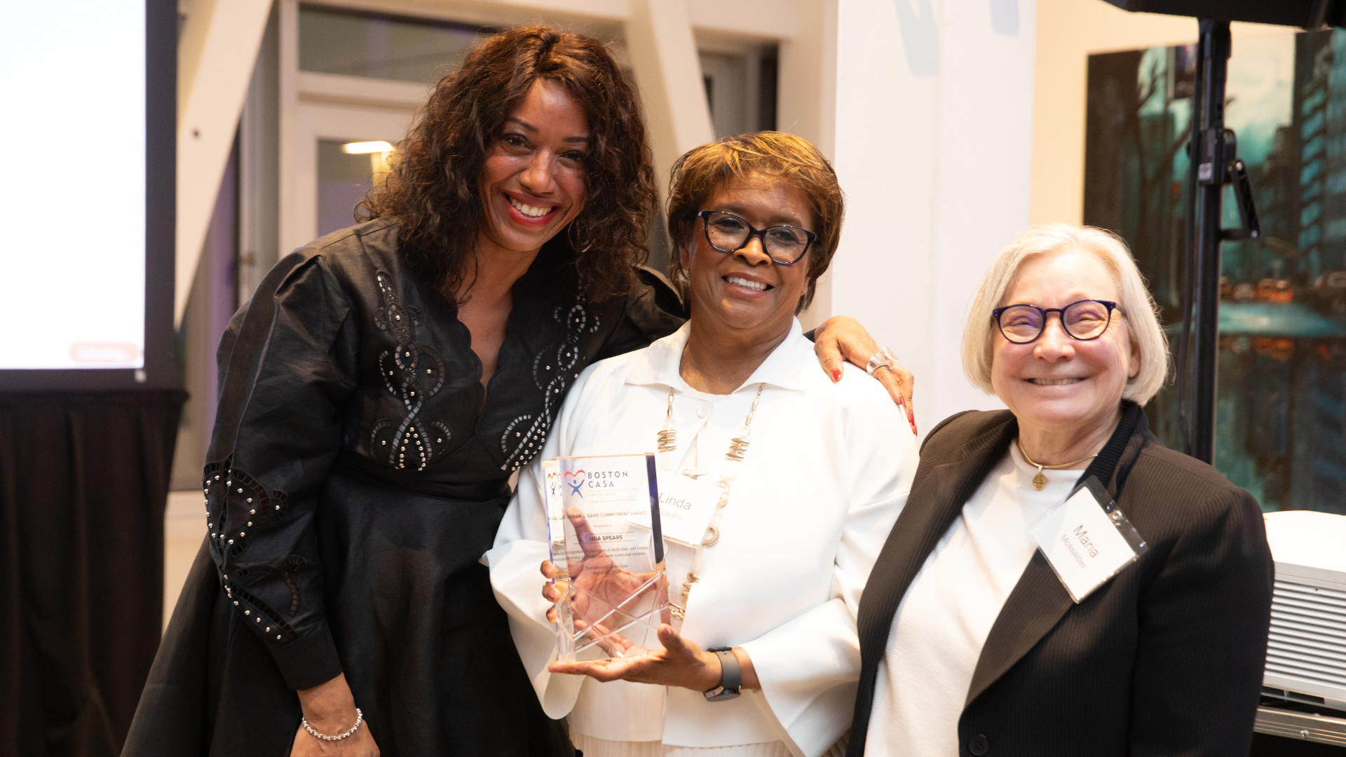 Nicole Stewart (left) at the 2024 Boston CASA Gala with a pair of team members.