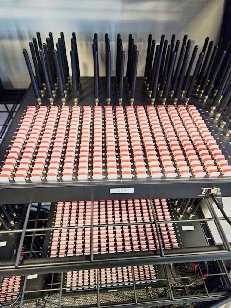 Part of a wall of SIM boxes that were seized by the agency
