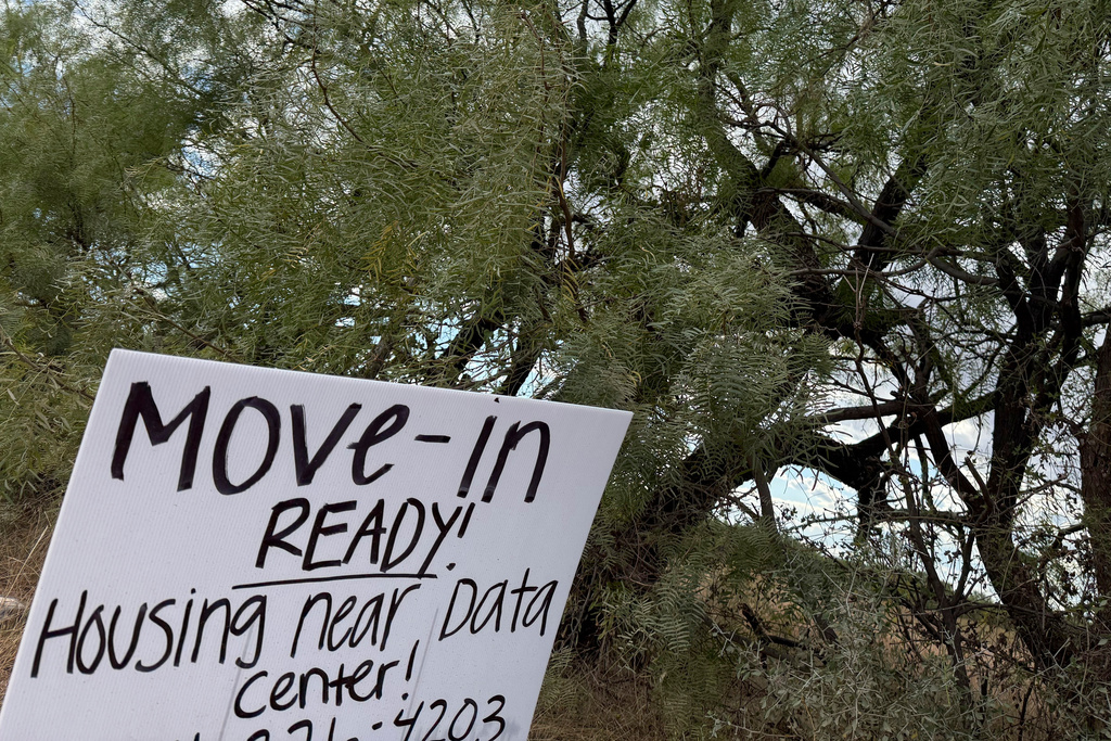 sign advertises housing for workers along the road to the Stargate artificial intelligence data center complex 