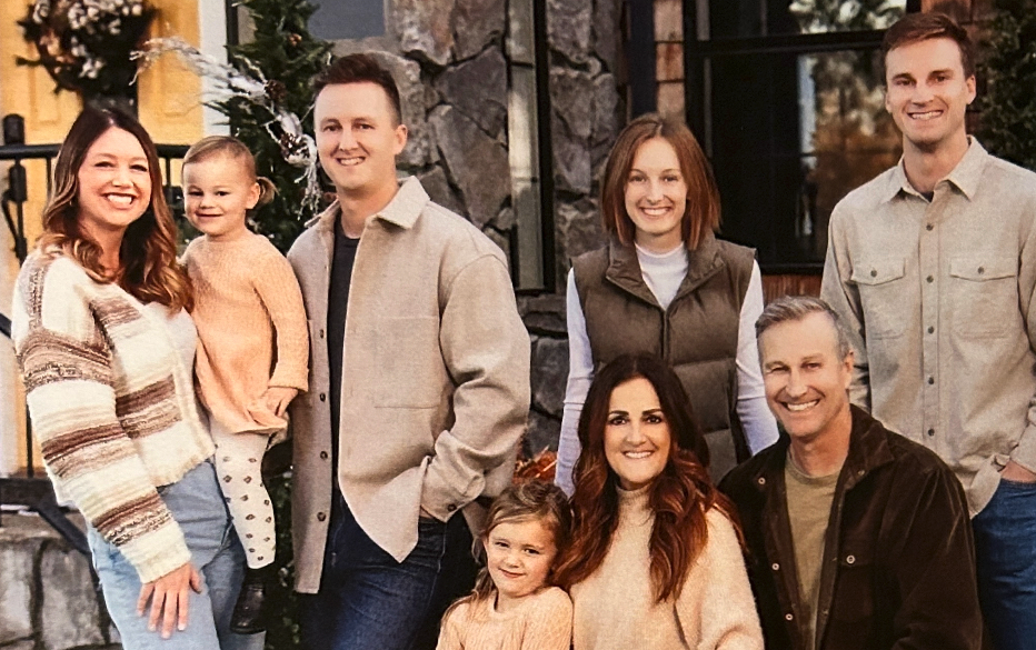 Six adults and two children, smiling