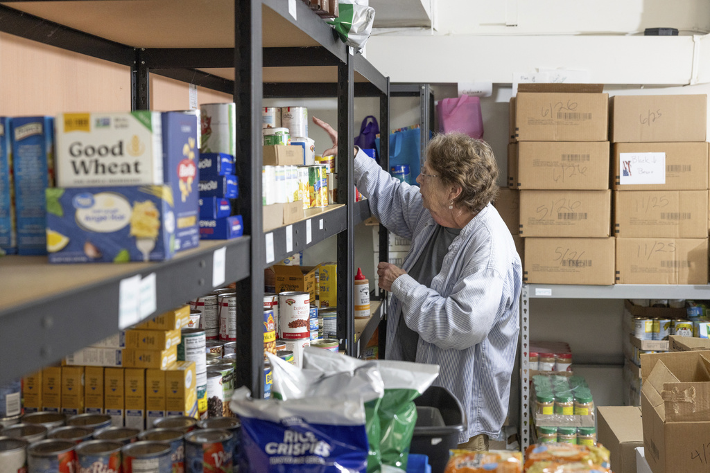 Phylis Allen organizes supplies at Neighbor