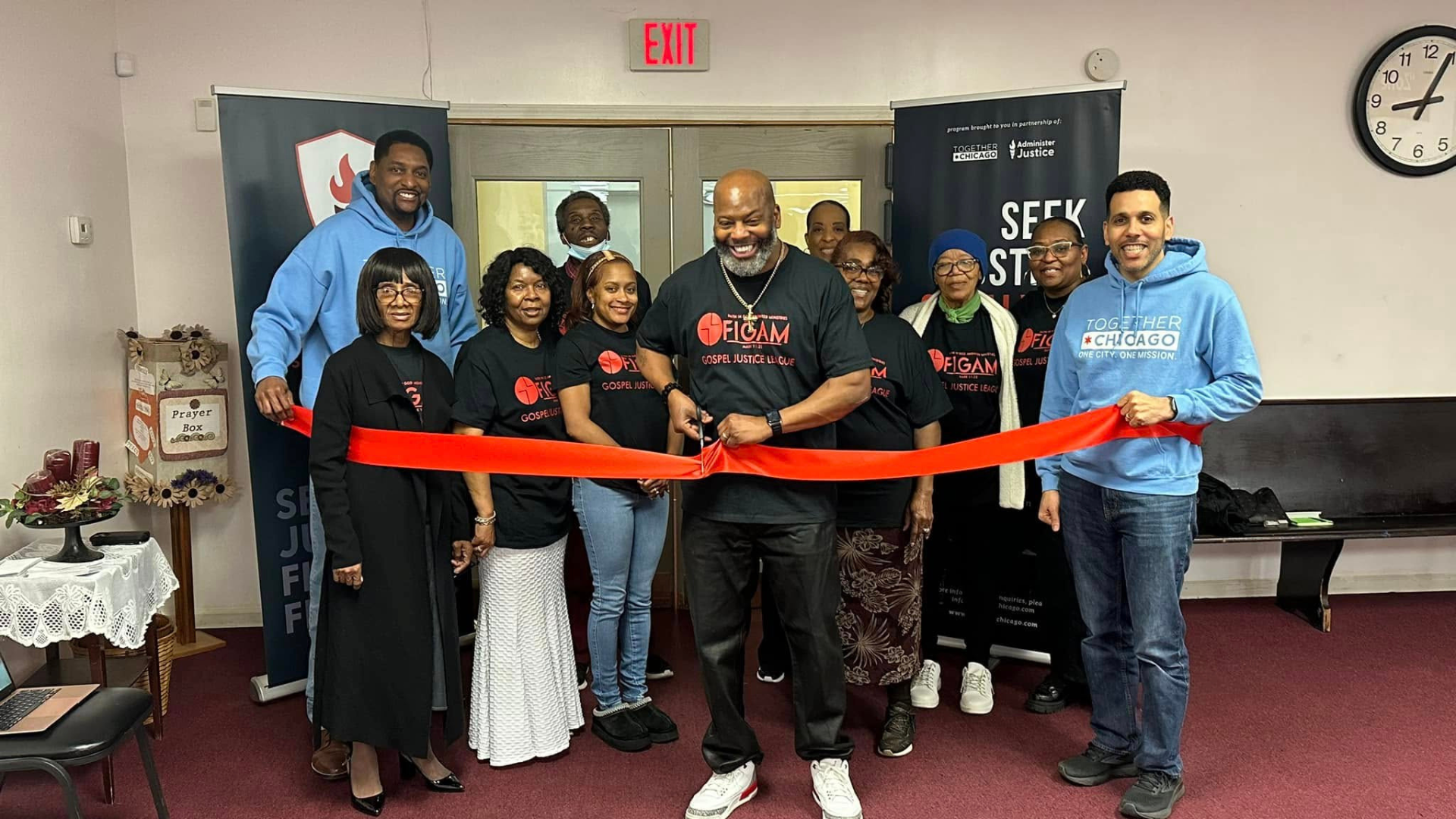 Banks (front right) celebrates a ribbon cutting ceremony with Together Chicago partners.
